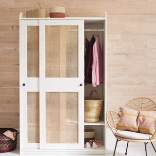 Rattan and white wardrobe and petal cane armchair