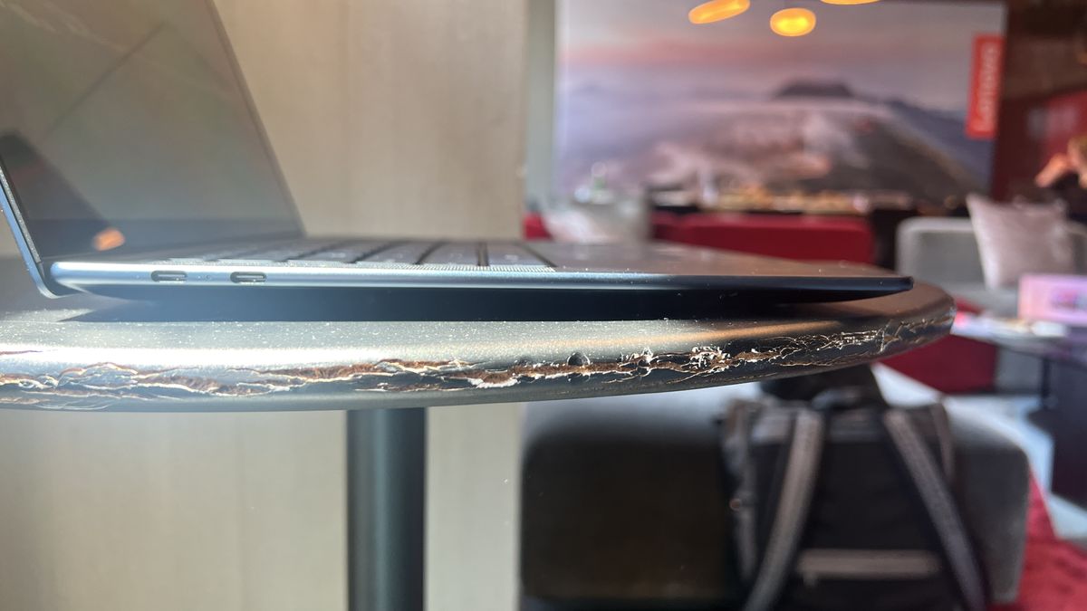 blue laptop on table