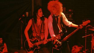 Izzy Stradlin (left) and Duff McKagan perform with Guns N' Roses at the Troubadour in Los Angeles, California on September 20, 1985