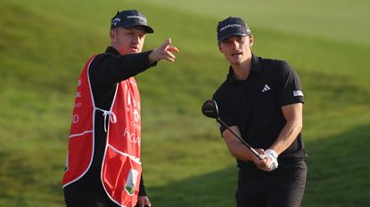 Nicolai Hojgaard and his caddie during a DP World Tour event