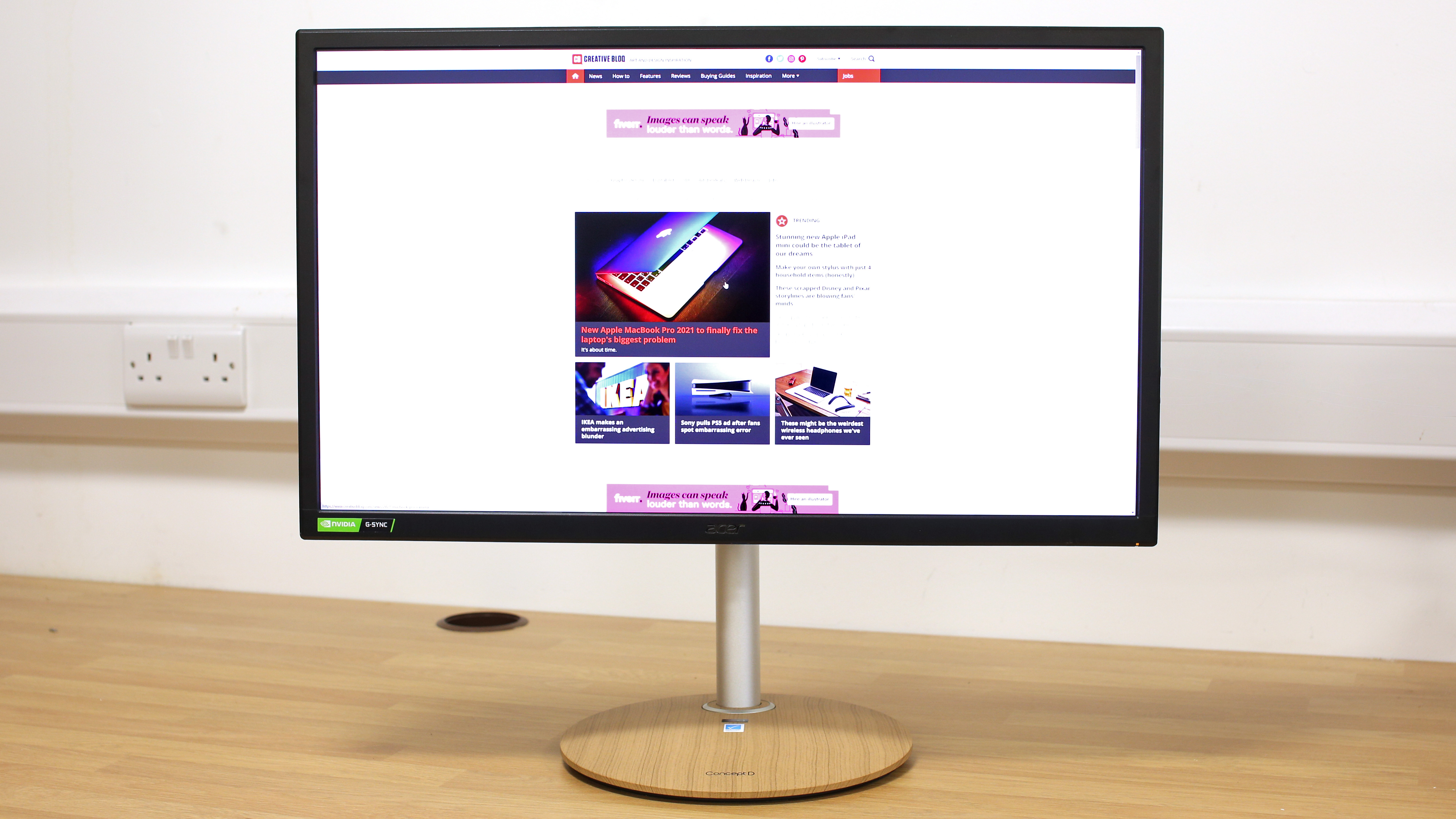 Product shot of the Acer ConceptD CP3271K, one of the best monitors for video editing, on a wooden desk