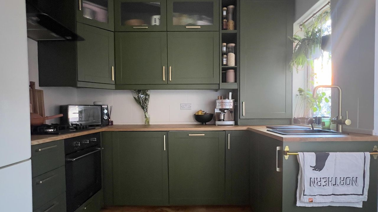 green kitchen with wooden worktops