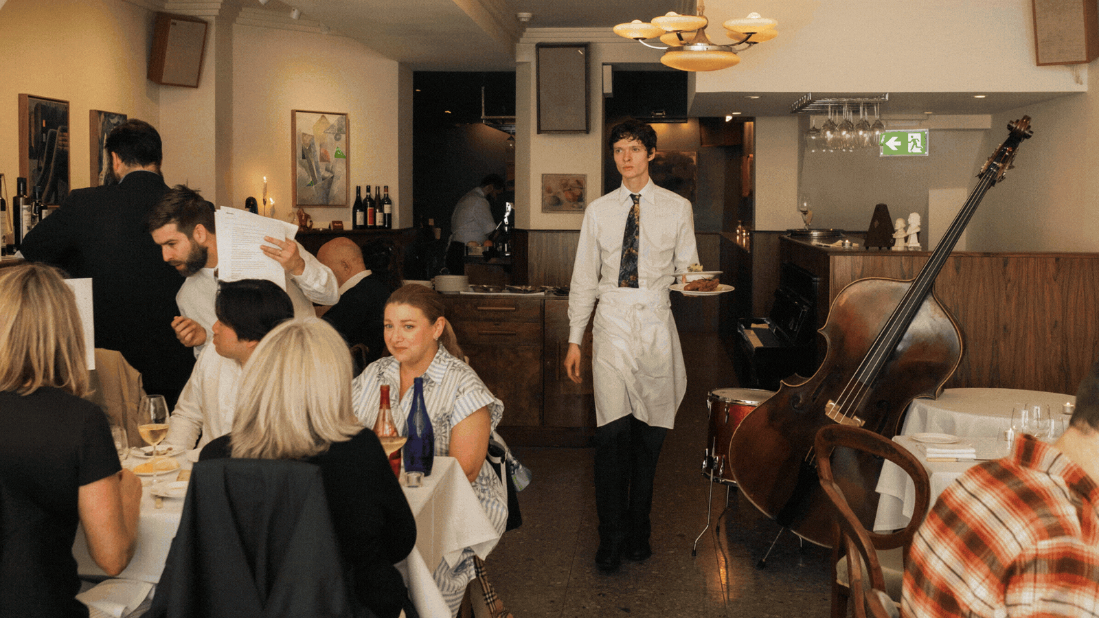 A rotating gif of restaurant interiors with a candle-lit atmosphere, original artwork, and quirky details.