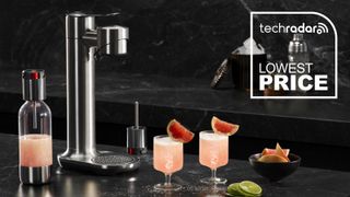 Breville Infizz Fusion sparkling beverage maker on a countertop with cocktails