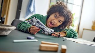 Lego Pirate Snub Fighter being played with by a child