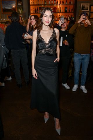 Alexa Chung in a black, lace-trimmed slip dress