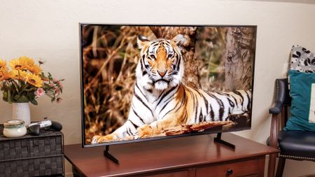 Samsung Q7F QLED TV on a side table