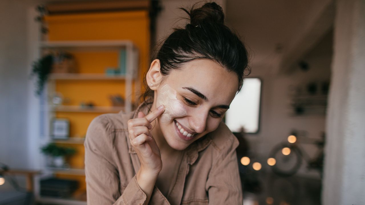 woman applying skincare