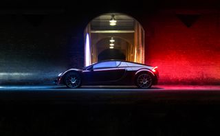 Vega EVX parked in front of a tunnel with lights
