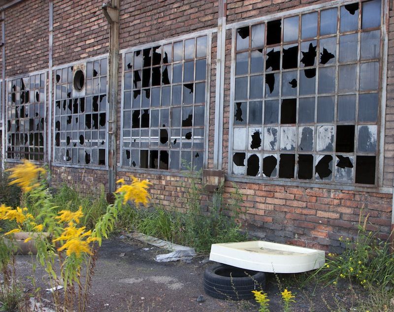 Broken windows in abandoned building