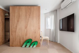 wood clad minimalist interior at House in Tamatsukuri