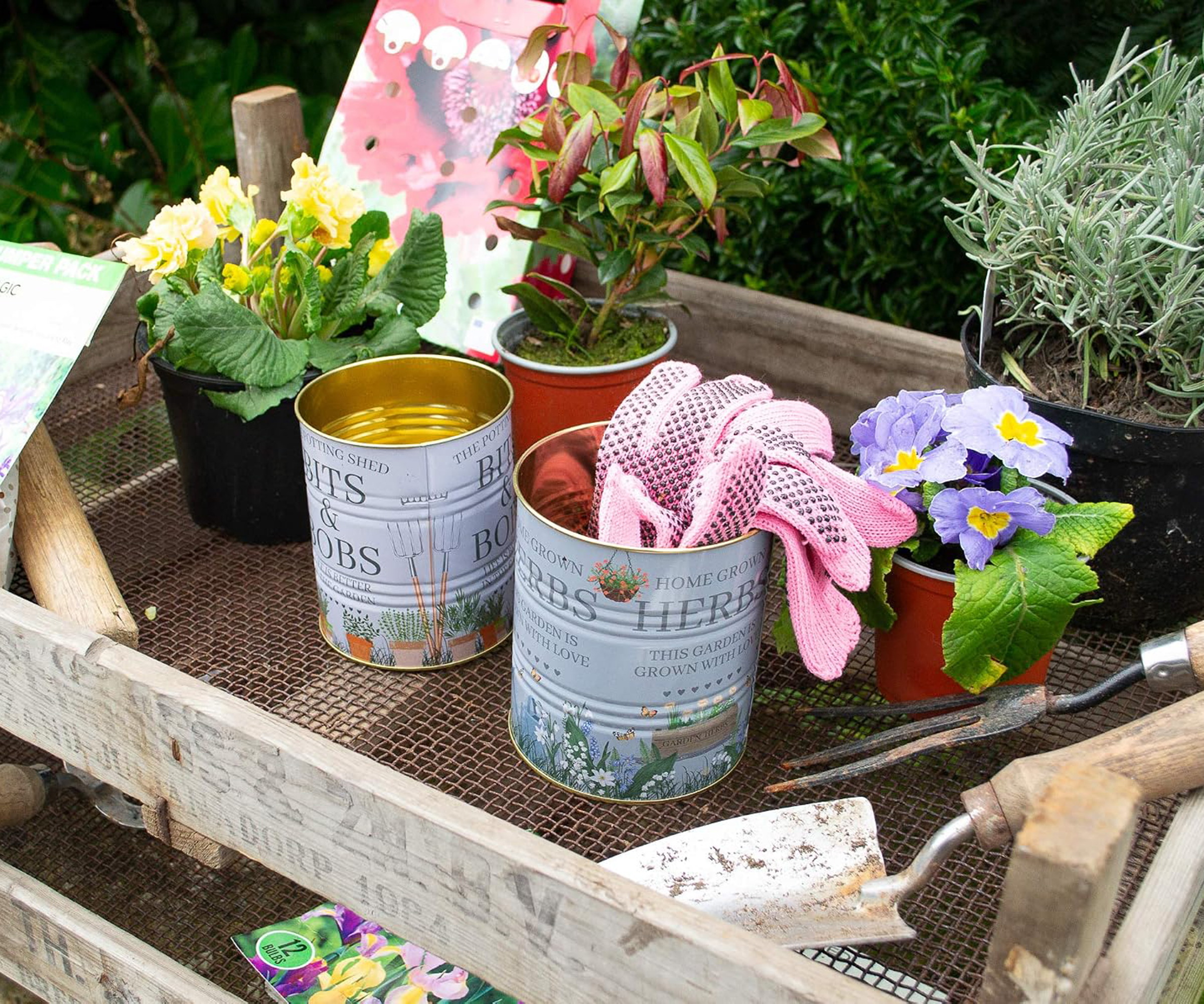 Pretty tin can storage tins on potting bench