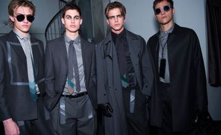 Models wearing clothing by Emporio Armani