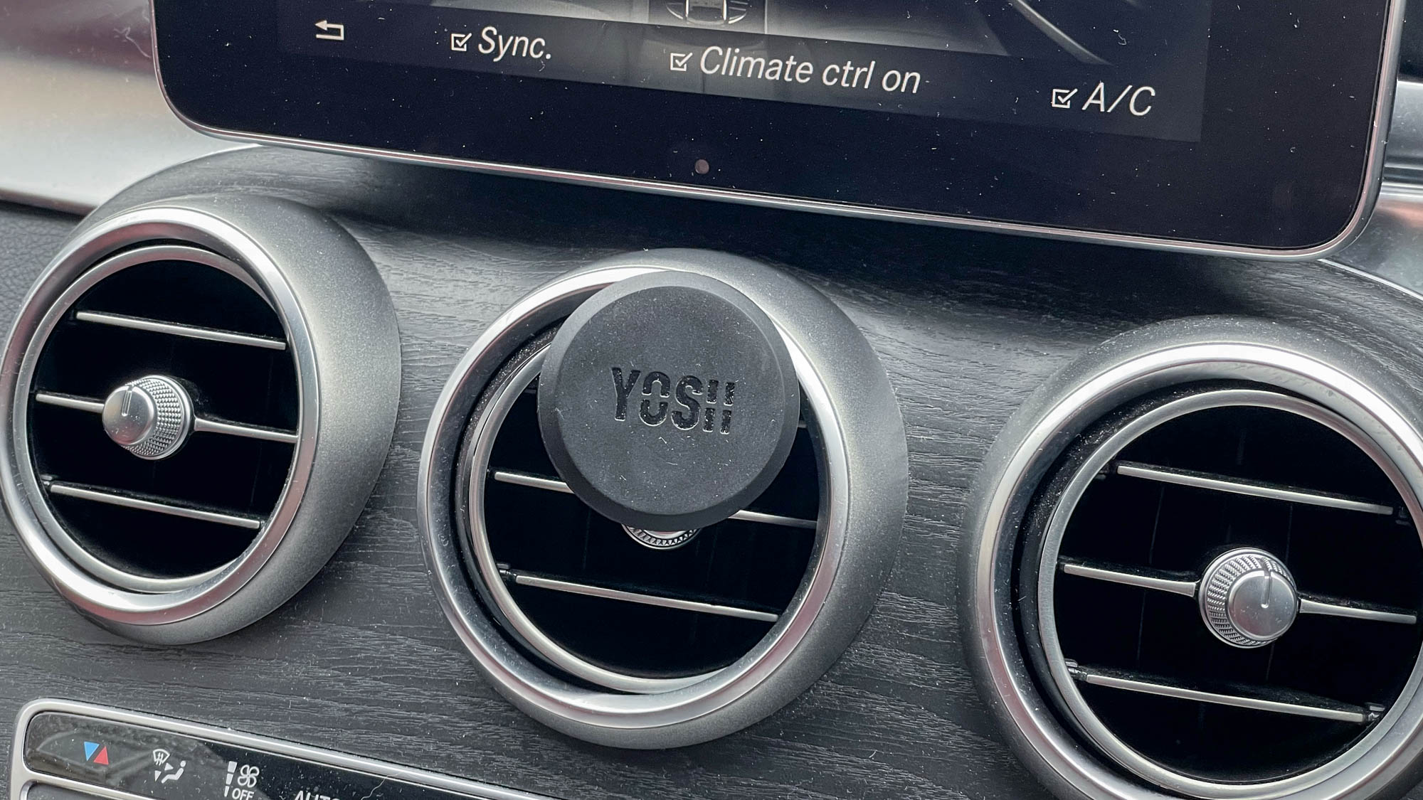 YOSH magnetic car phone mount shown in a car dash vent