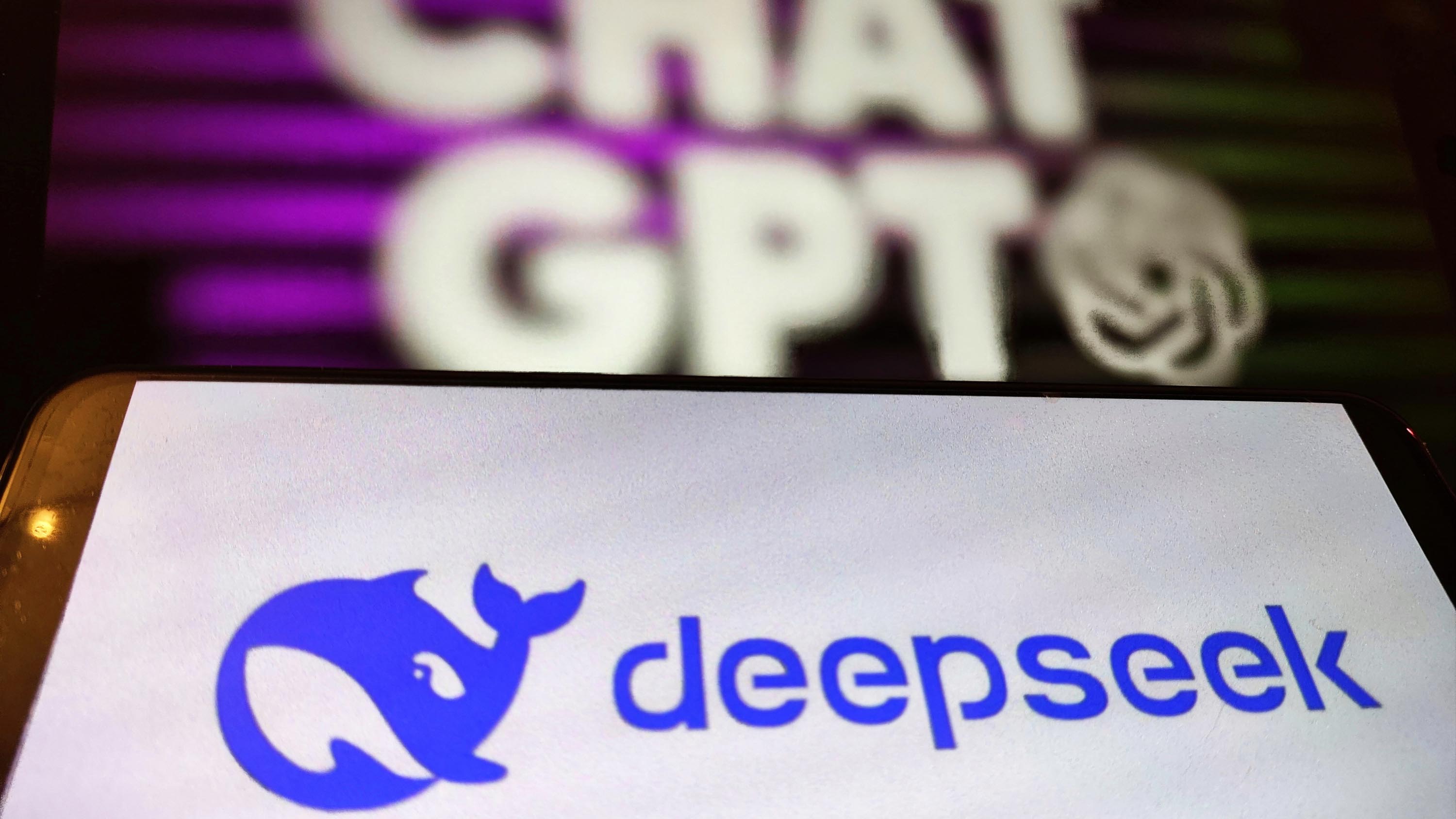 An illustration photo shows the logo of DeepSeek and ChatGPT.