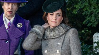 Catherine, Princess of Wales adjusts her coat collar as she attends the Christmas Day Church service 2019