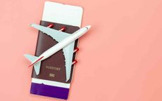 Concept art showing a toy airplane sitting on top of a passport. 