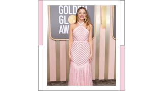 Margot Robbie wears a pink dress as she attends the 80th Annual Golden Globe Awards at The Beverly Hilton on January 10, 2023 in Beverly Hills, California.