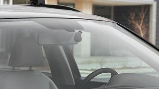 The Garmin Dash Cam Mini 2 mounted inside a windscreen