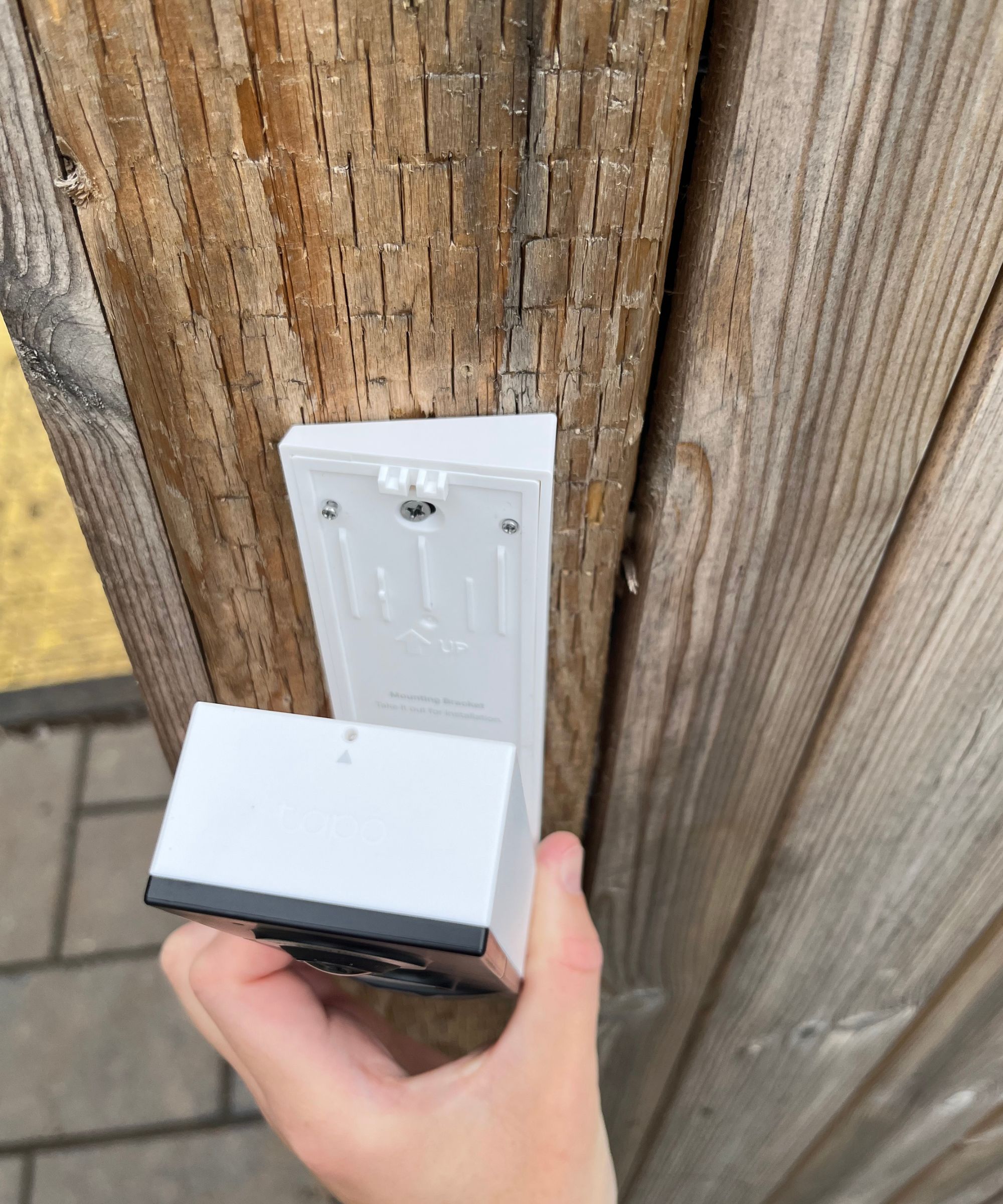 Securing the Tapo D235 to the wedge and mount on to a wooden fence next to our side gate.