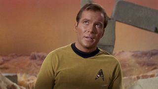 A screenshot of an episode of Star Trek showing William Shatner as Captain James T. Kirk wearing the iconic Starfleet badge