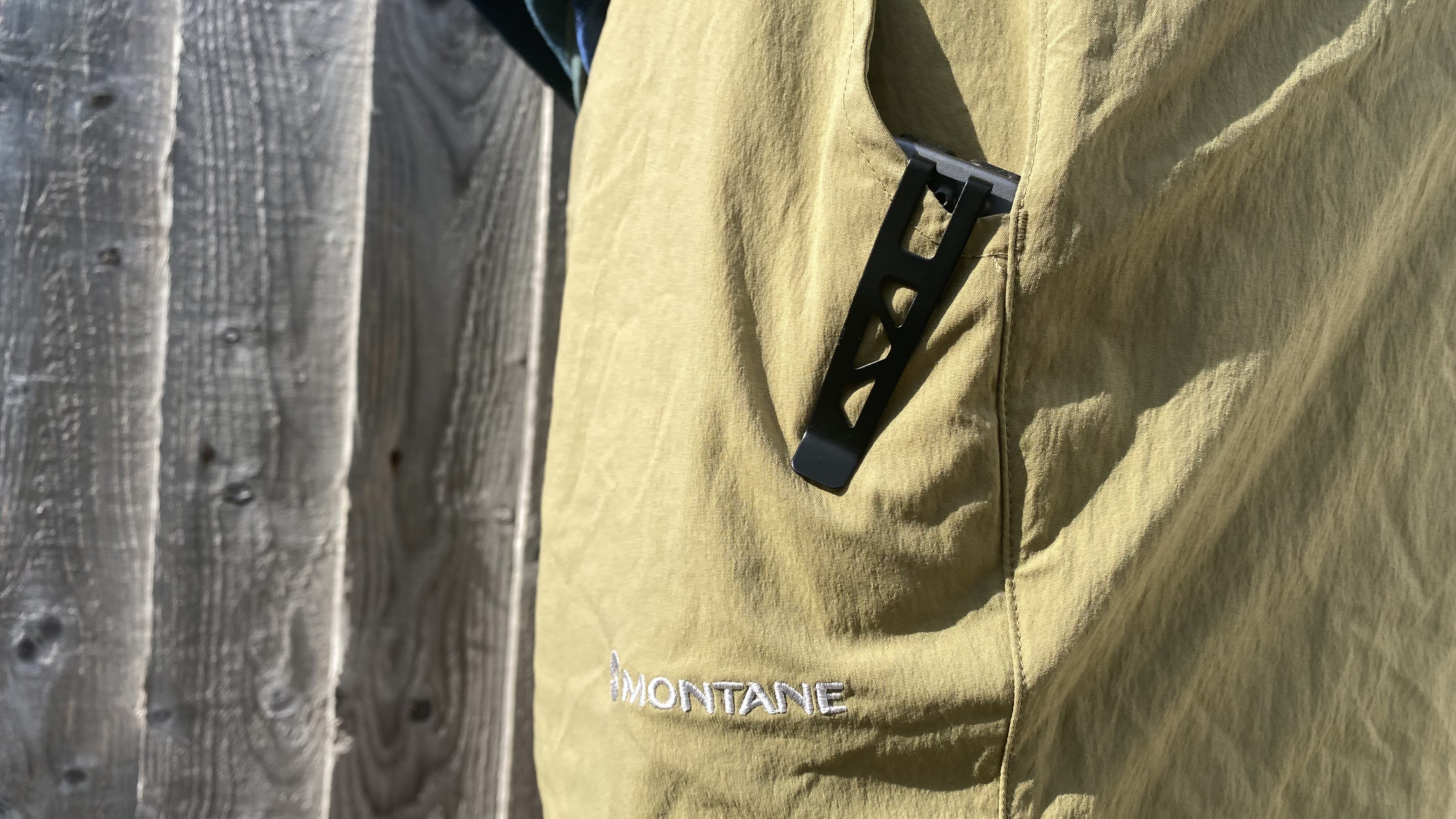 Nebo Edge 2K in a walker's pocket with the clip showing