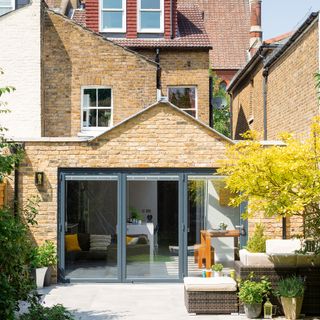 Exterior of brick house with extension and bifolding doors