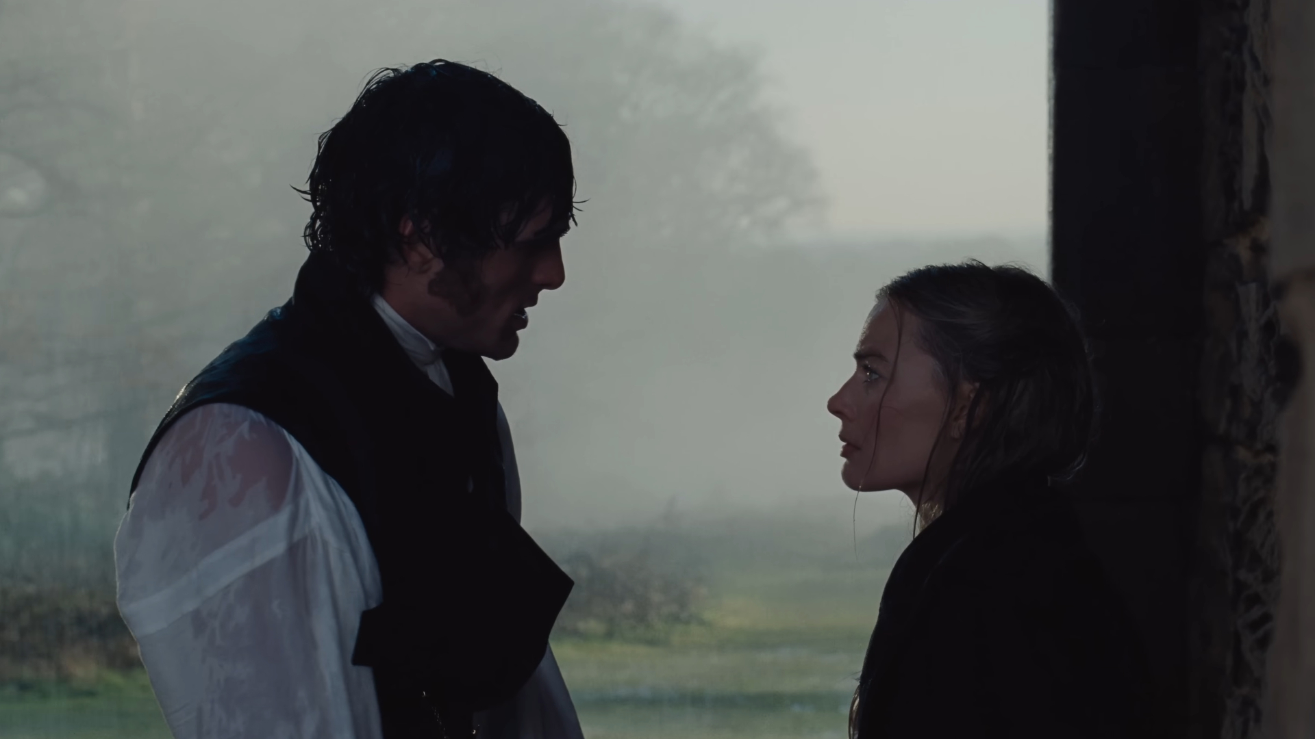 Wuthering Heights scene from the trailer of the two leads looking at each other 