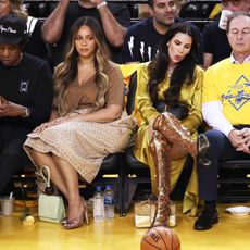 Yellow, Fan, Event, Team, Competition event, Basketball, Thigh, Sitting, Audience, Crowd, 