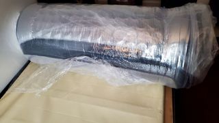 Nolah Evolution 15 mattress rolled and wrapped in plastic