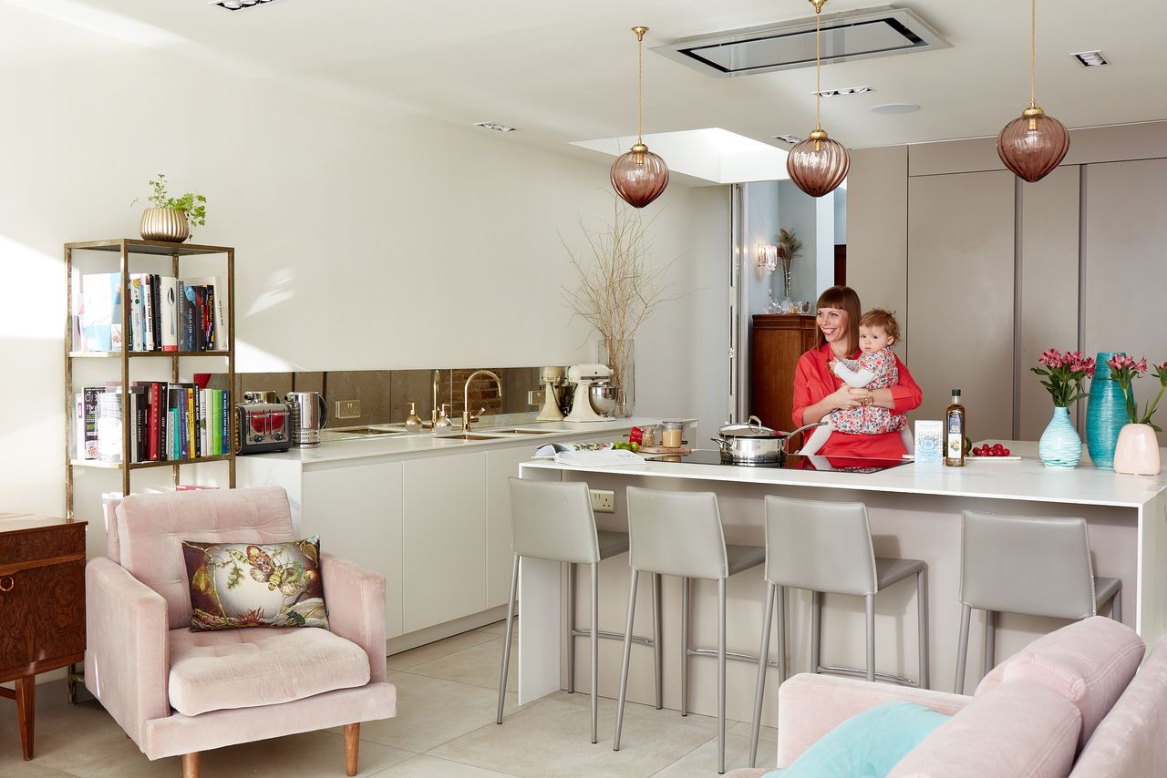 bright white kitchen with pink and earthy textures