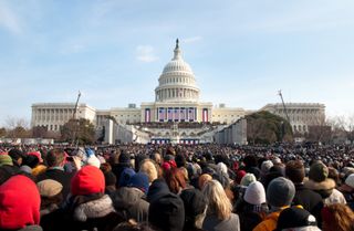  A crowd of warmly dressed onlookers attends the 2009 inauguration of President Barack Obama.