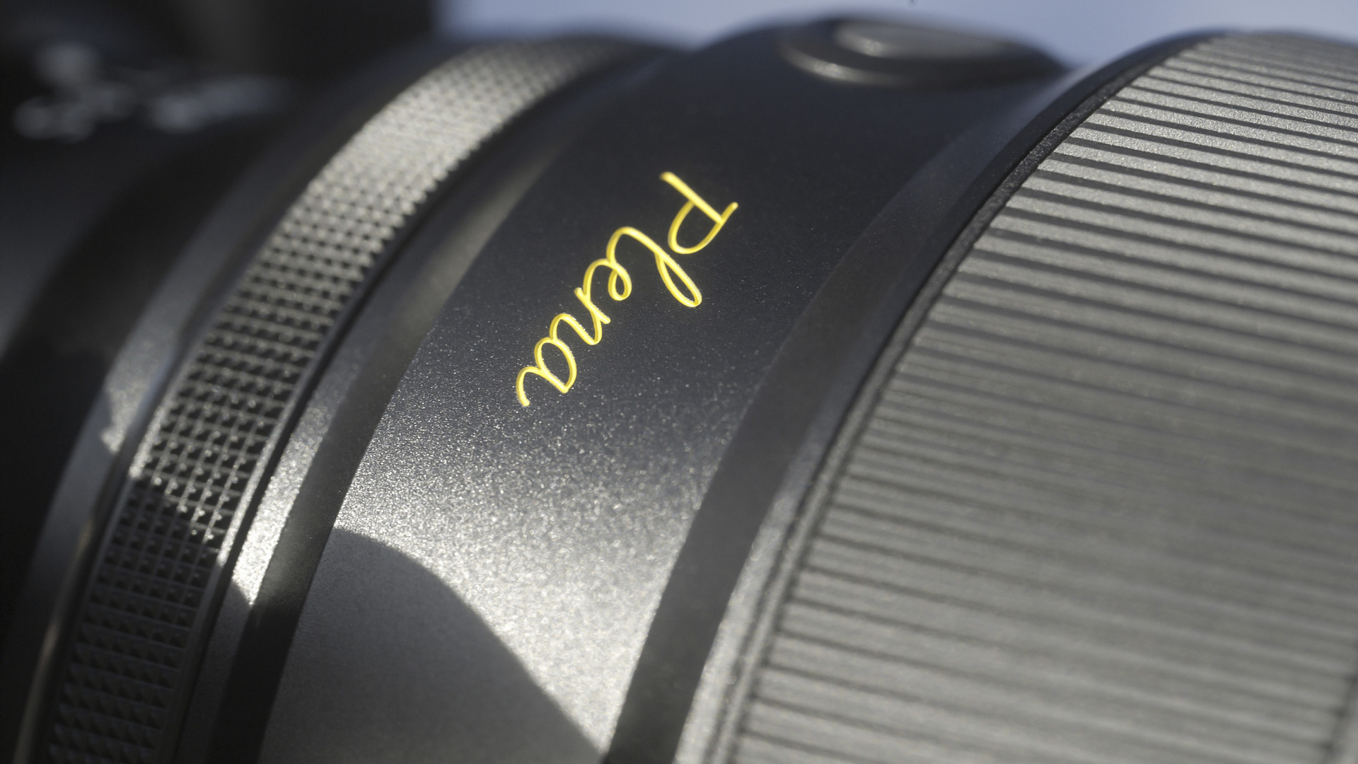 Closeup of the Nikon Z 135mm Plena lens' Plena signature