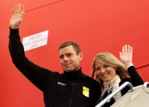Evans and his wife Chiara Passerini wave to the crowd