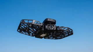 HoverAir X1 PROMAX in flight against a blue sky