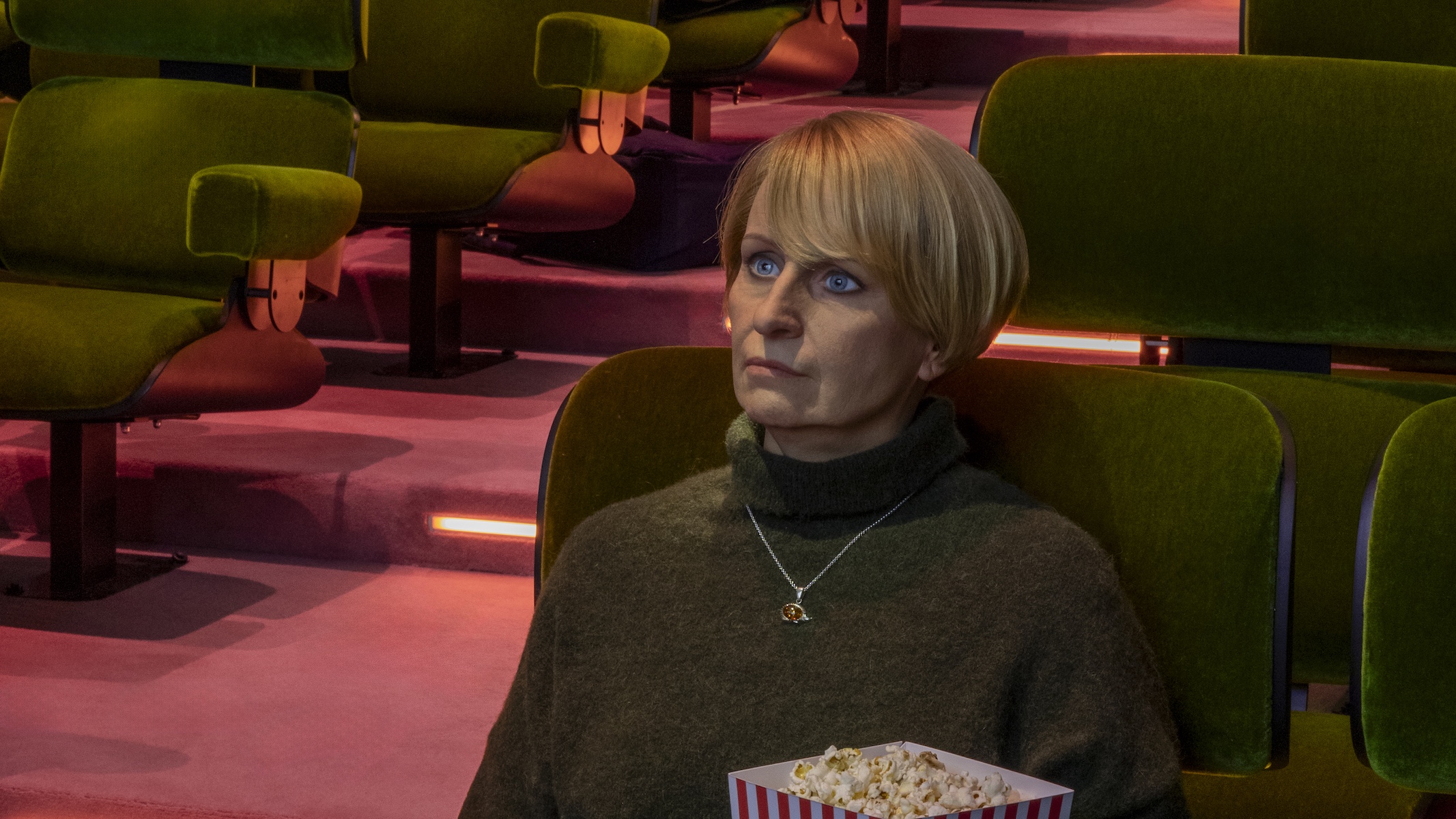 Prada Mode Elmgreen &amp;amp; Dragset installation which features hyper-realistic human figures sitting in a cinema
