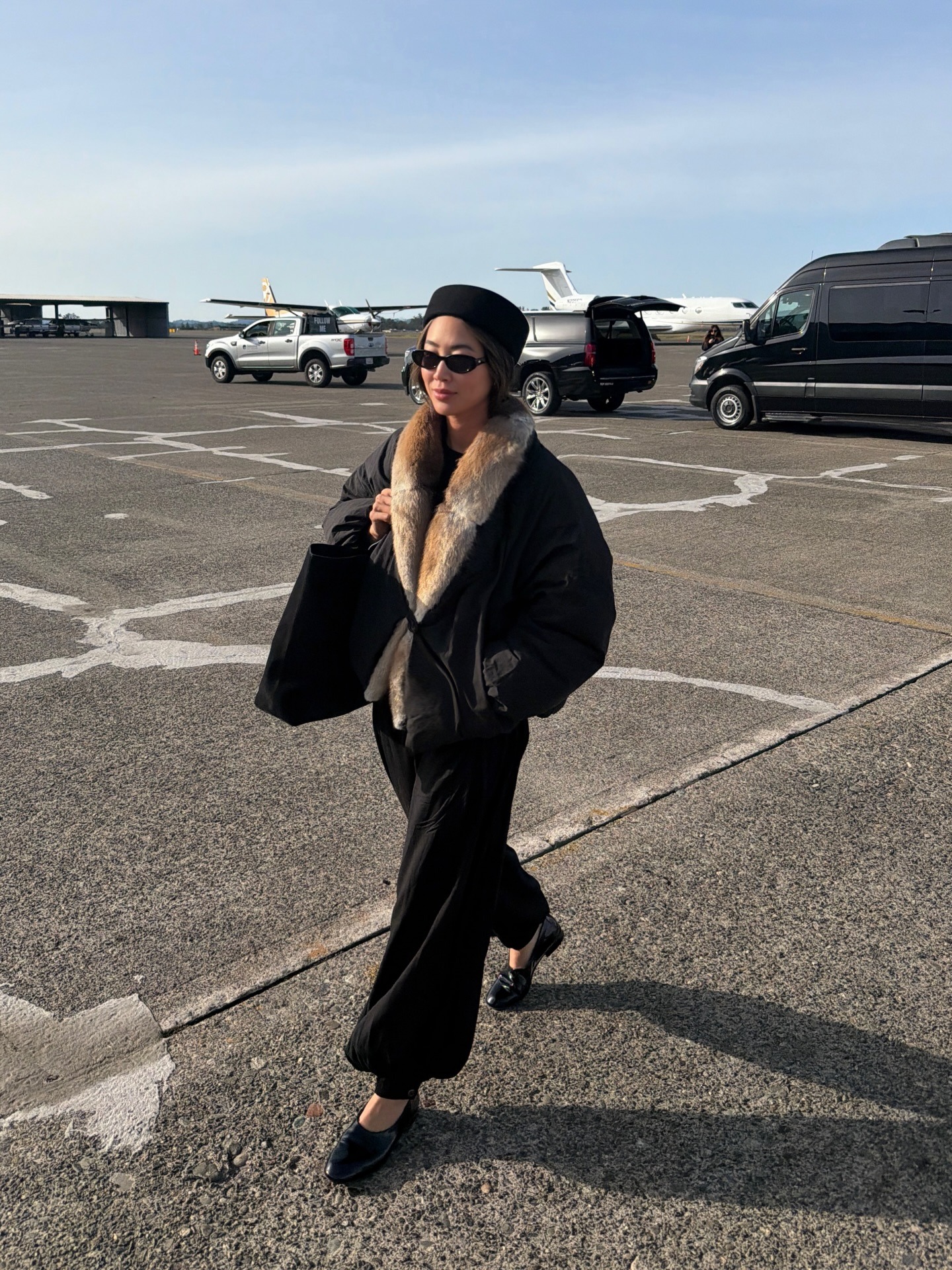 Woman wearing a business-class travel outfit.