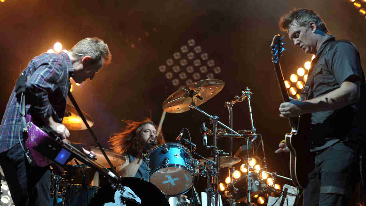 Them Crooked Vultures performing onstage in 2010
