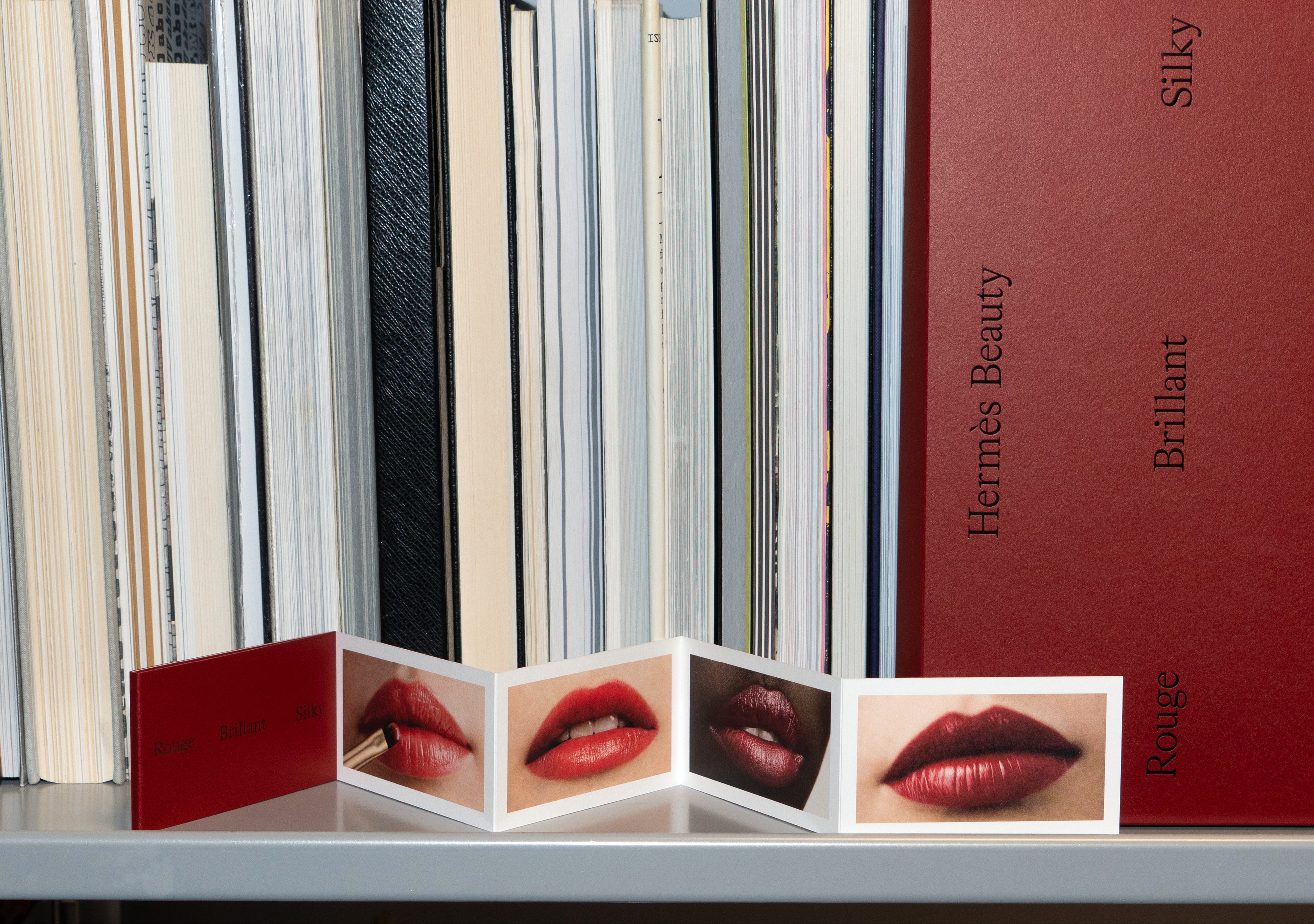 small book arranged across a shelf