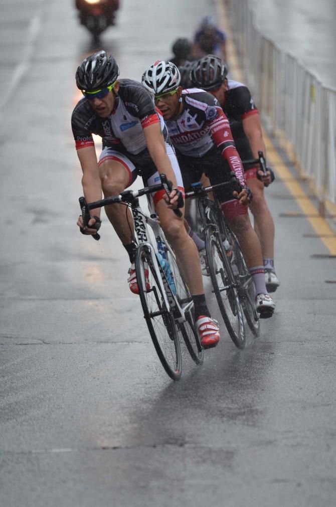 The peloton broke up after a crash on the back side of the course