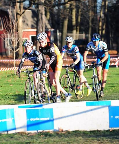 Adam Craig (Giant) about to pass another group at the barriers.