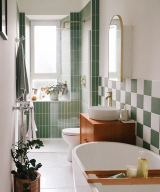 Small bathroom with green and white tiles