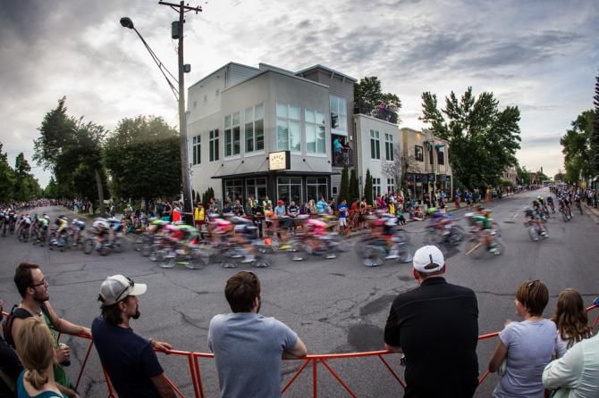 Fans watch as the men's field begins to string out.
