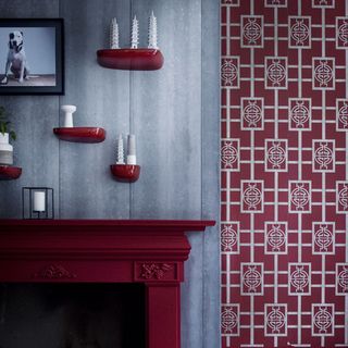room with printed wallpaper with burgundy colour and frame