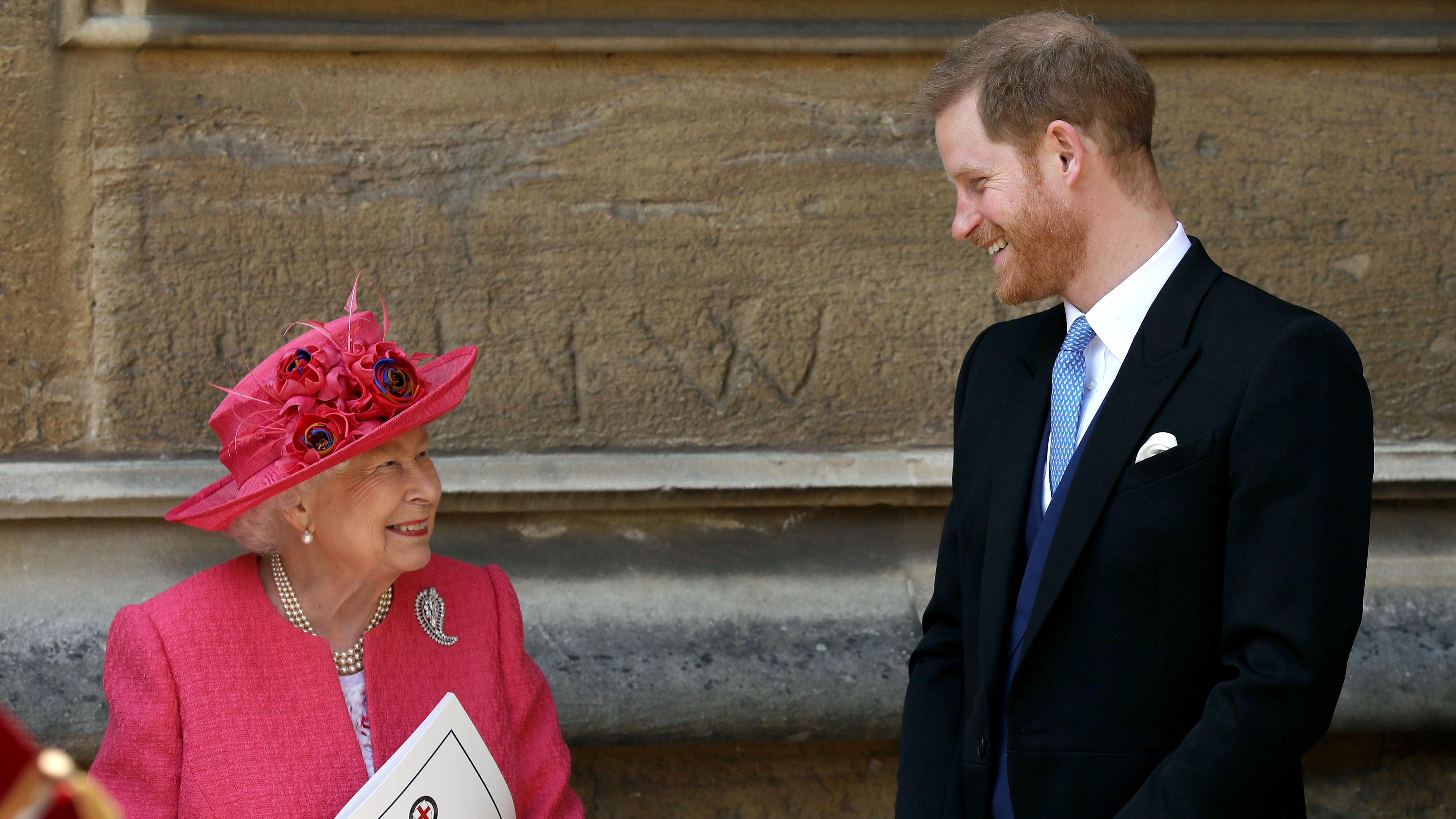 Queen Elizabeth II speaks with Prince Harry, Duke of Sussex as they leave after the wedding of Lady Gabriella Windsor to Thomas Kingston at St George&#039;s Chapel, Windsor Castle on May 18, 2019