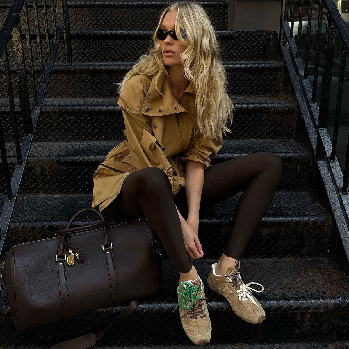 Elsa Hosk in dark brown leggings and suede sneakers