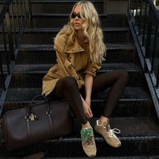 Elsa Hosk in dark brown leggings and suede sneakers