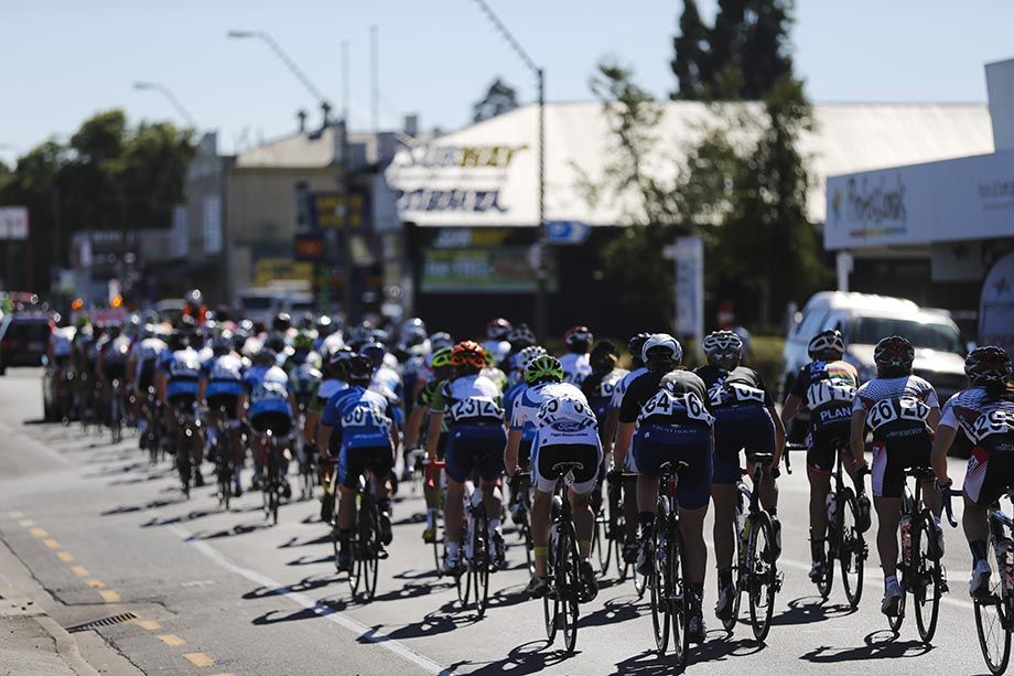 The peloton pass through downtown Masterton in the neutral zone