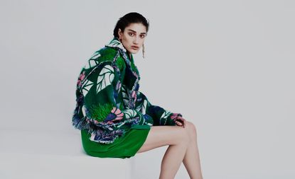 model with green clothing