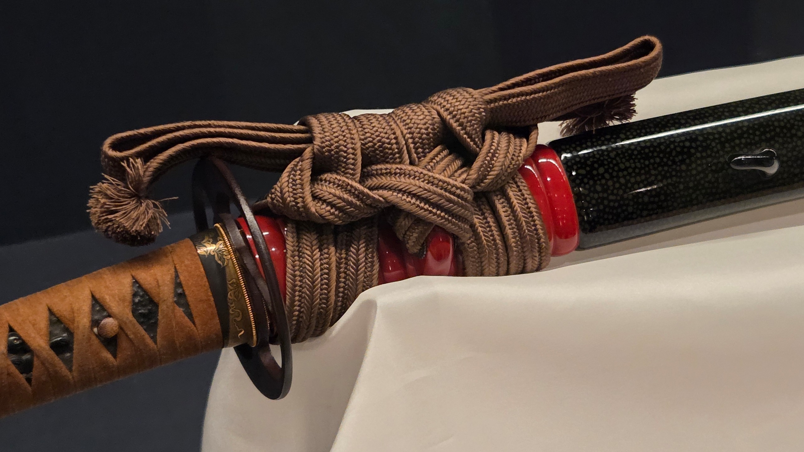 A close-up of a katana in its sheathe